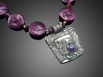Koi Ripple Garden -layered fine silver set with Cubic Zirconium. Necklace is purple and white coin pearls.McKenzie's Jewelry by Nancy Koehler SOLD
