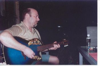 Rick Buck playing Dale's Blue Ovation guitar
