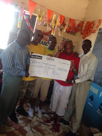 Bobby and Dereck hand over a Cheque
