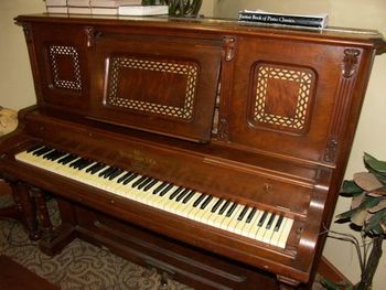 This is a Heintzman & Co. upright. Built in 1894, Heintzman was the primary (and maybe the only?) piano builder in Canada.
