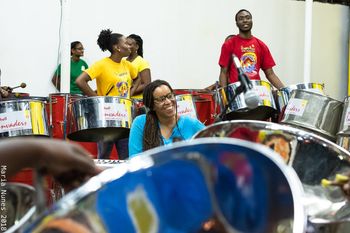 Chantal Esdelle works with Invaders Steel Orchestra as they prepare for Jazz in the Yard with Moyenne.
