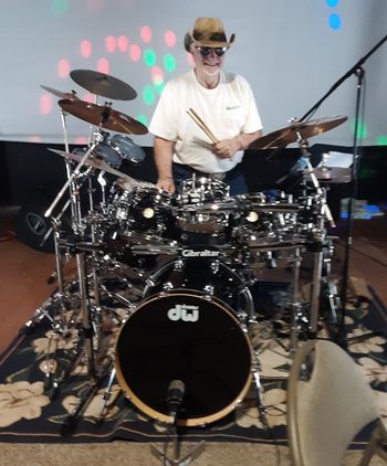 Dallas stands behind his DW drum kit before the show begins

