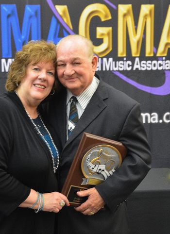 Louise Moody poses with her husband John after he receives his Lifetime Achievement Award.
