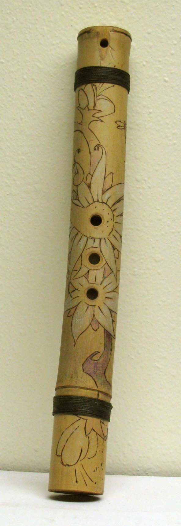 Played with the left nostril, and left hand covering the three holes. Often called the love flute since the breath from the nose could not tell lies. Decorated with wood burn designs for $35.00