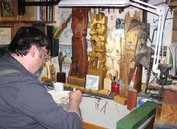 Dave carving a small figurine

