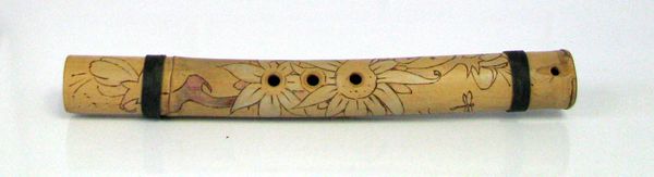 The Ohe Hano Ihu or Hawaiian nose flute - this flute has a wood burned design with green bindings. $35.00