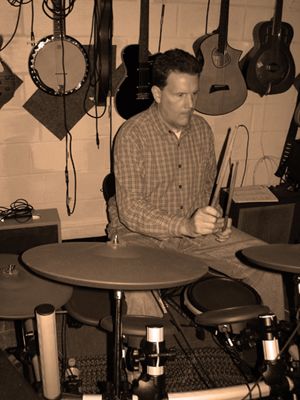 Rob beatin' a drum Olive St Rehearsal Room
