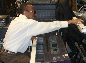 HUBERT TEMBA playing two keyboards like the pianist YANI on May 29, 2009.(Photo by John Lockner).
