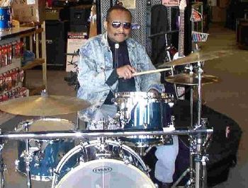 Hubert Temba sat on a drum set inside Music Go Round in Maple Grove, MN, USA on Friday, April 3, 200
