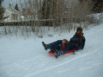 hawk and dad sledding
