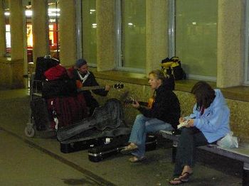 Chris and Jules busking at the Dijon train station, while Lindsay writes in her journal.
