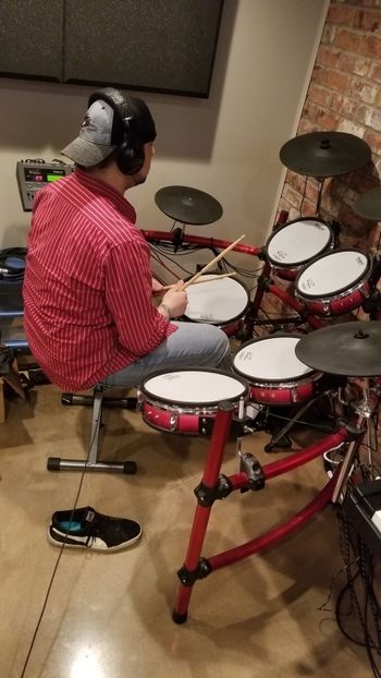 Robert Salzgeber using V-drums for a drum track.
