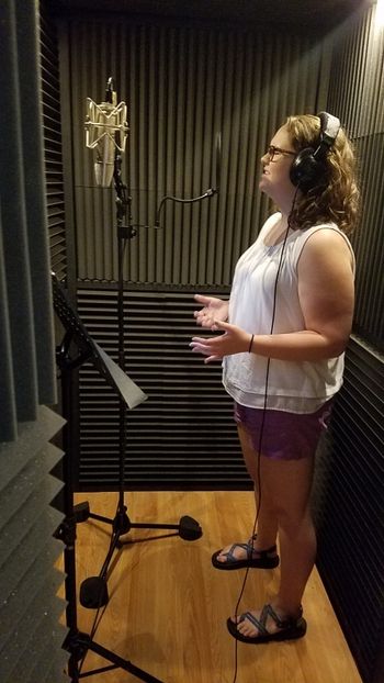 LilyAnne Miller recording a vocal track.
