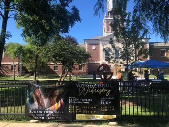 Austin Town Hall park with Wo nderful Wednesday banner of Larry and rapper FURY  Aug 2022

