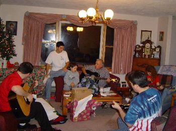 A Christmas Jam Session With the Grandkids and Kids (Sons).  It Was A Musical Instrument Christmas. "The Gloryland Train" was the Song. (L to R) Tim (Guitar), Greg, Ryan, Lynn (Guitar) Micaela (Bass),
