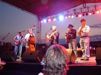 Lynn Beckman (Center) On Stage With Ronnie Reno & The Reno Tradition. (l to r) Mike Scott, banjo; Heath Van Winkle, upright bass; Lynn; Ronnie Reno, guitar; John Maberry, mandolin; Jackie Miller (not
