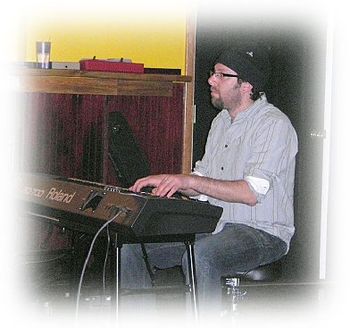 Adam Michael Rothberg playing piano on "This Message"
