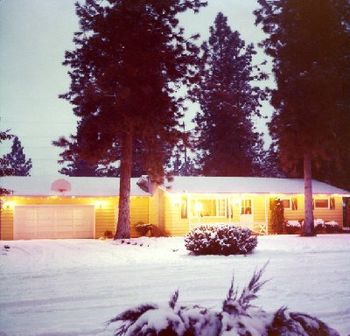 The house I grew up in (with the ice skating rink in our backyard) - Spokane, WA. I'm a fan of the colored big bulbs around the roof...they made my room glow in multi-color (1977).
