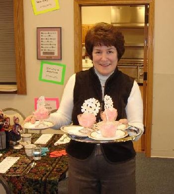 Nancy O'Neill serving the impressive dessert-Peppermint Ice Cream topped with a snowflake cookie compliments of Langes Cafe
