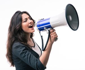 Pretty lady shouting into a megaphone about Clark