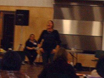 Fuzzy photo of me singing at the CAS conference banquet in Chase, BC
