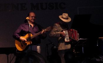 Ossie on guitar, Cain on accordion
