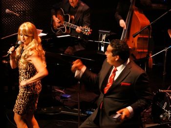 Singer KatieCat doing the Nancy Sinatra shtick with Roman Palacios
