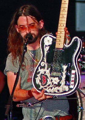 Shooter Jennings showing off his #2 leather covered Telecaster and matching strap
