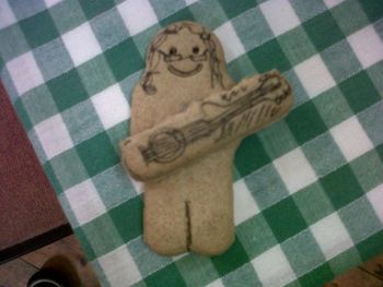 Biscuit Steve Emma Baker Emma made this biscuit during a gig at Quatt Village Hall, she's captured Steve's style we think! Amazing what you can do with a digestive and a biro.
