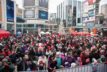 Beebo performs for crowd at the Dowtown Toronto Santa Parade Breakfest
