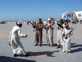 Essaouira, Morroco playing ancient drums and stringed instruments.
