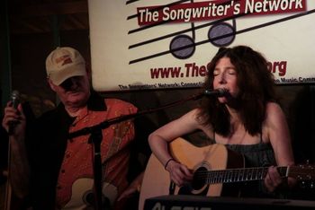 Bill Cagle and I singing "Closed for Renovation" at a SongNet Showcase
