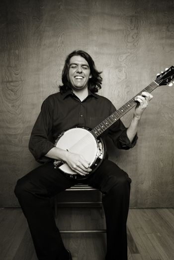 banjo smiles (bw) Photo Credit: Cristina Mezuk
