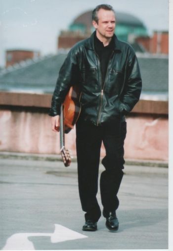 Robin - guitar on the rooftops by Jonathan Keenan
