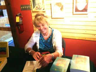 Author signing books at Santa Fe's Collected Works book store.