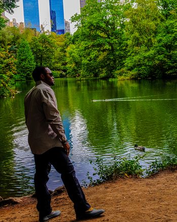 Positive Perspectives of Tyrone Smith in Sperry Cutwater Deck Boot in Central Park NYC fall foliage
