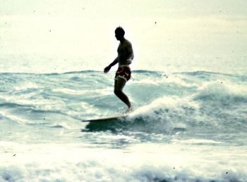 and i would have to say the 'Rossco' Ross Edge was the classiest 'trimmer' around!.. Ross trimming on a Waipu Cove wave summer of '66......Ross looking very Hawaiian here...could be mistaken for Waikiki....
