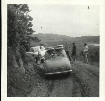 a young Doug Ferguson looking on at the damage to another car .... ..on one of those dodgy Whangamata roads....poor ol' Dougs mums car (with boards on)...lookin' a bit crumpled...."sorry mum...wasn't my fault...true...i wasn't speeding...honest truth"
