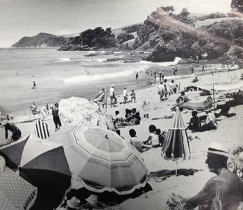 Waipu Cove summer of '61 How beautiful does that look...hot day ..offshore winds...warm water ..nice little swell..remember those days!!! awesome!! beach looks quite steep, dosen't it!..couple of surfboards in the middle and about 6 surf reels out..interesting!!
