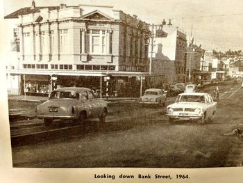 Downtown sleepy old Whangarei 1964.... even a guy on a pushbike in the middle of the road....guarantee he wasnt wearing a helmet then....no such law in '64.......in fact there was no seatbelts, and we would always pile at least 6 in a car...3 across the front seat...remember!!
