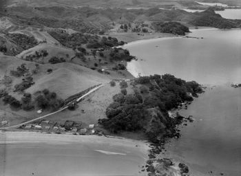 Beautiful holiday spot... Oakura (Northland)..summer of '59 North end ........usually needs an east to south/east swell to work ......Ohawini Bay in the background..
