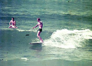 Nice shot of Ian Mclean...Oakura...summer of '65 who's that sitting in the water?....

