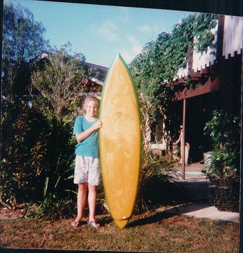 kristy langridge with first surfboard early 80s
