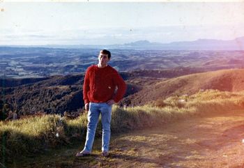 Mike standing outside his bedroom window..1962... Bream Bay and Ruakaka in the distance...
