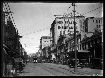 Looking up Queen Street, Auckland just north of the corner of Fort Street showing trams 1918
