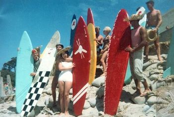 Xmas of '62 Waipu cove Northland What a classic photo...tells a whole story dosen't it! Its amazing how boards started off so streamlined then radically changed into 6 stringer 'logs'!!!!!! ..photo taken in front of the old Waipu Cove surfclub....
