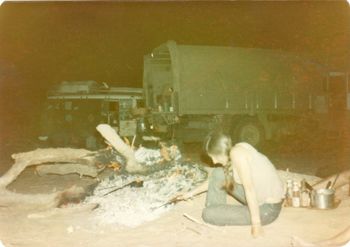 The 'Siafu' Expedition army truck we began to travel with...southern Sahara Paula cooking something in the embers...nearly everything we ate now was in a packet or a tin!!! ....getting really low on water and fuel now....expect a waterhole about 200 kms further south....
