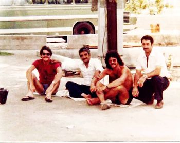 Brian King (long hair) with WA mate Kerry Harford, in 1977 Istanbul. Getting windshield replaced by local bus company . Note how well we’re dressed compared to our fantastic hosts.
