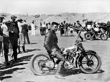 Photographic Works Percy Coleman on Royal Enfield motorcycle at Waikanae Beach 1930 Gisborne
