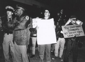 Protest outside the Bush, Clinton, Perot presidential debate, East Lansing, MI, October 19th, 1992. Attempting to shed some light on issues that now, only after decades of endless war and decline, are finally being addressed more openly. Namely, that our much vaunted "Democracy," is a facade.
